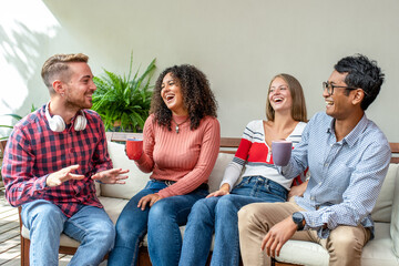 group of friends laughing and drinking coffee, meeting of generation z people, adult student in erasmus, multicultural and biracial people having fun