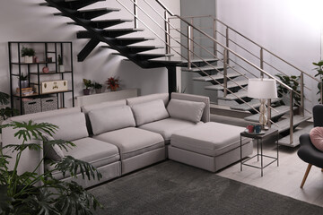 Stylish living room interior with comfortable sofa