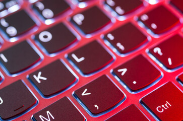 Laptop keyboard illuminated by a nice red light