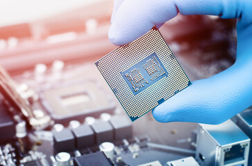 engineer hand holding computer microprocessor