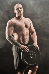 Fototapeta na wymiar muscular guy with disk