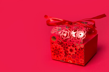 red romantic gift on red background copy space