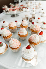 the wedding candy bar is filled with different desserts. wedding table at the banquet