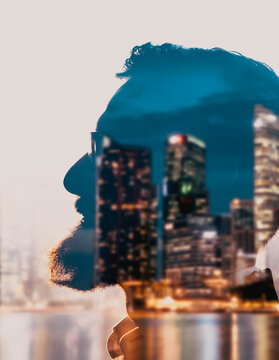double exposure of businessman head and sunrise over skyscrapers career success