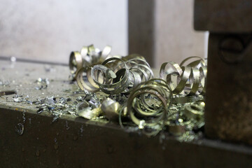 Coils of metal shavings close-up. Metal shavings on the machine.