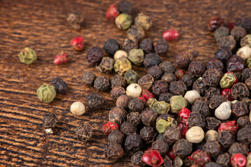 Colored peppers mix on the wooden background