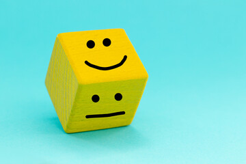Choosing a Positive mindset, Sadness turns into a smile, Concept, Yellow brick with painted human...