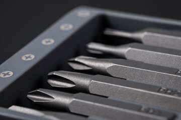 Set of bits for screwdriver. Metal bits for screwdriver. Tool set for household use. Nozzles and adapters for screwdrivers. Head different size hex driver.