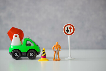a road worker or a worker with a jackhammer in various situations on the road, dolls 