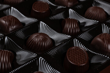 Box with chocolate candies' rows