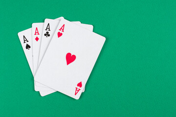 Playing cards on green background.