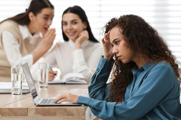 African American woman suffering from racial discrimination at work