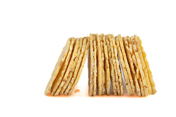 Round cornbread standing on a white background.