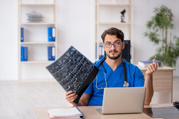 Young male doctor radiologist working in the clinic