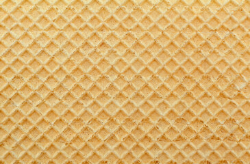 Wafers. Background of yellow waffles close-up. Pastry. Sweetness