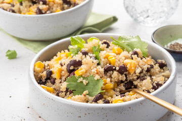 Vegan meal of quinoa with corn and black beans. Healthy organic vegan food