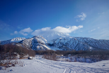 Fototapeta premium Snow covered Vilyuchinsky volcano in winter