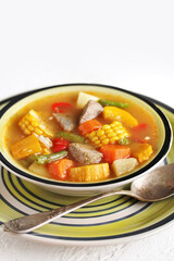 Mexican Beef Soup. Latin American soup with beef, potatoes, carrots, corn on the cob, green beans, peppers, Beef Broth,
copy space, place for text, country style 