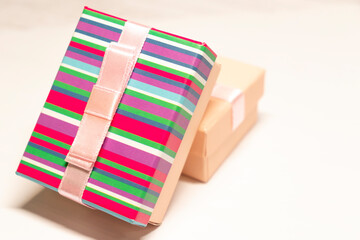 Fototapeta na wymiar Gift boxes with ribbon on white background. Present for Birthday, Women's day or Valentine's day