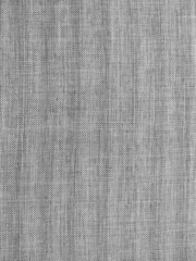 Closeup grey fabric texture with copy space. Macro shot of upholstery for furniture. Selective focus of gray textured fabric. Wallpaper and background. Thick gray material for the interior.