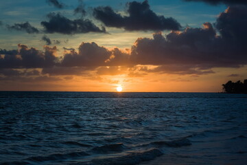 Fototapeta na wymiar Beautiful sunrise at sea. Dawn on the Atlantic ocean. The sun is