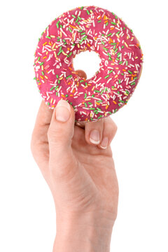 Donut close-up in hand on a white background. Round donut isolated on white background.