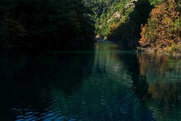 autumn mountain landscape with shady lake