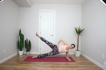 woman doing yoga in studio