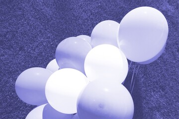 Very pery color 2022. holiday balloons are a great background for design.