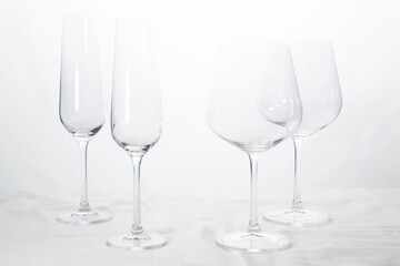 Wine and champagne glasses on a white background.