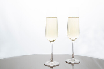 Champagne glasses on a white background.Alcoholic beverages.