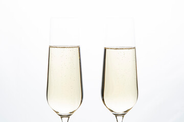 Champagne glasses on a white background.Alcoholic beverages.