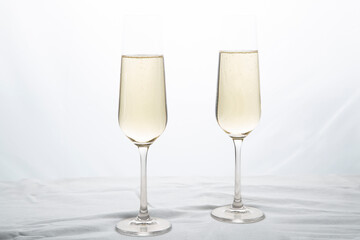 Champagne glasses on a white background.Alcoholic beverages.