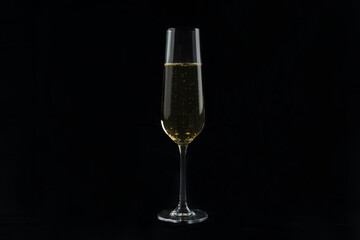 Champagne glasses on a black background.Alcoholic beverages.