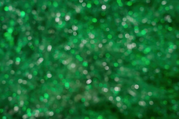 Green  bokeh from many round highlights. Background. Texture.