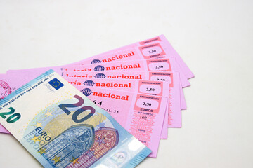 Close-up of a 20 euro bill on some national lottery tickets