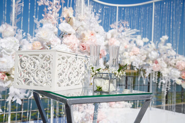 Festive arch for the ceremony of painting the newlyweds on the wedding day, wedding decor with fresh flowers