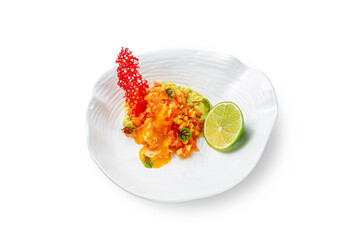 Mango and salmon salad with sauce and avocado puree with lime and young beet leaves garnished with isomalt on a plate on a white isolated background