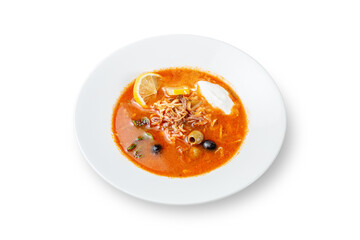 Hot Dishes. Hodgepodge with olives, sour cream and lemon in a plate on a white isolated background