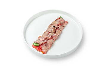 Salad and vegetables with spinach wrapped in bacon slices and stuffed with Feta cheese, spinach and sun dried tomato in a plate on an isolated white background