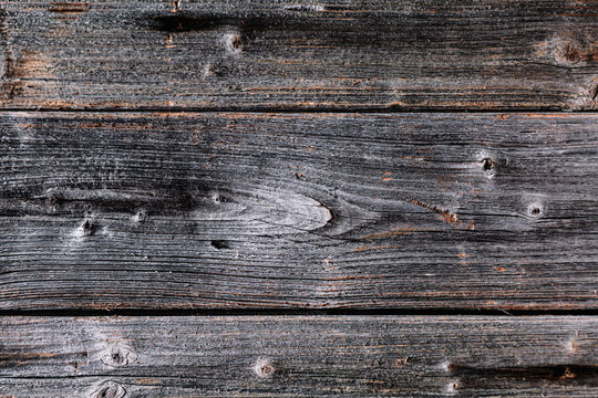 Textured old, wooden boards with peeling old paint, with cracks, background.