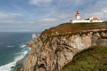 Fototapeta na wymiar Beautiful view of Cabo da Roca Lighthouse on the cliff in Colares, Portugal