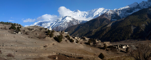 Panorama of mountains and snow in the Himalayas trekking along Annapurna Circuit in Nepal. © Tristan Barrington
