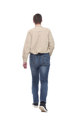 Back view of walking handsome man in jeans