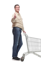 Side view of man with an empty shopping cart making a thumb up gesture
