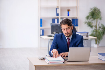 Fototapeta premium Two male colleagues working in the office