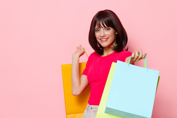 portrait woman smile colorful packets happiness cropped view