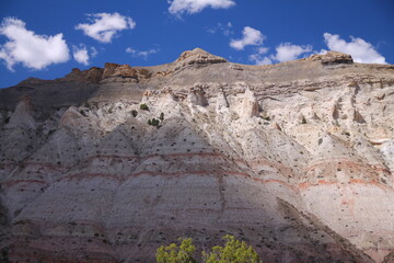 The white and pink rock walls with the blue sky of the Kodachrome Basin State Park