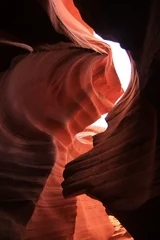 Acrylglasbilder Braun The contrast between the shadows and the lights inside the narrow red Antelope Canyon  © willeye