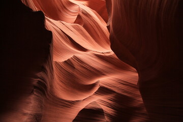 Bumps and dips on the walls of the red rocks of the Antelope Canyon